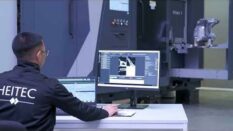 An engineer monitoring a robotic CT scan and analysis system as it inspects a manufactured component. Image courtesy of Heitec