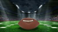 Unraveling Deflategate: Football stadium with closeup of football on field