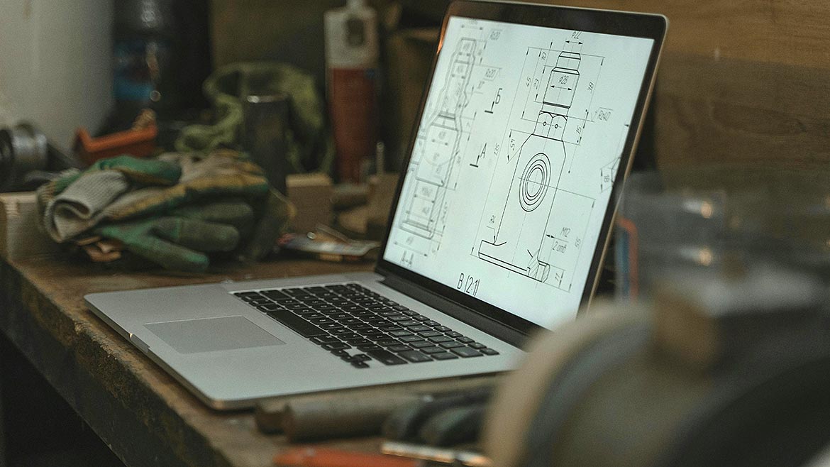 Laptop on the desk with an illustration on the screen.