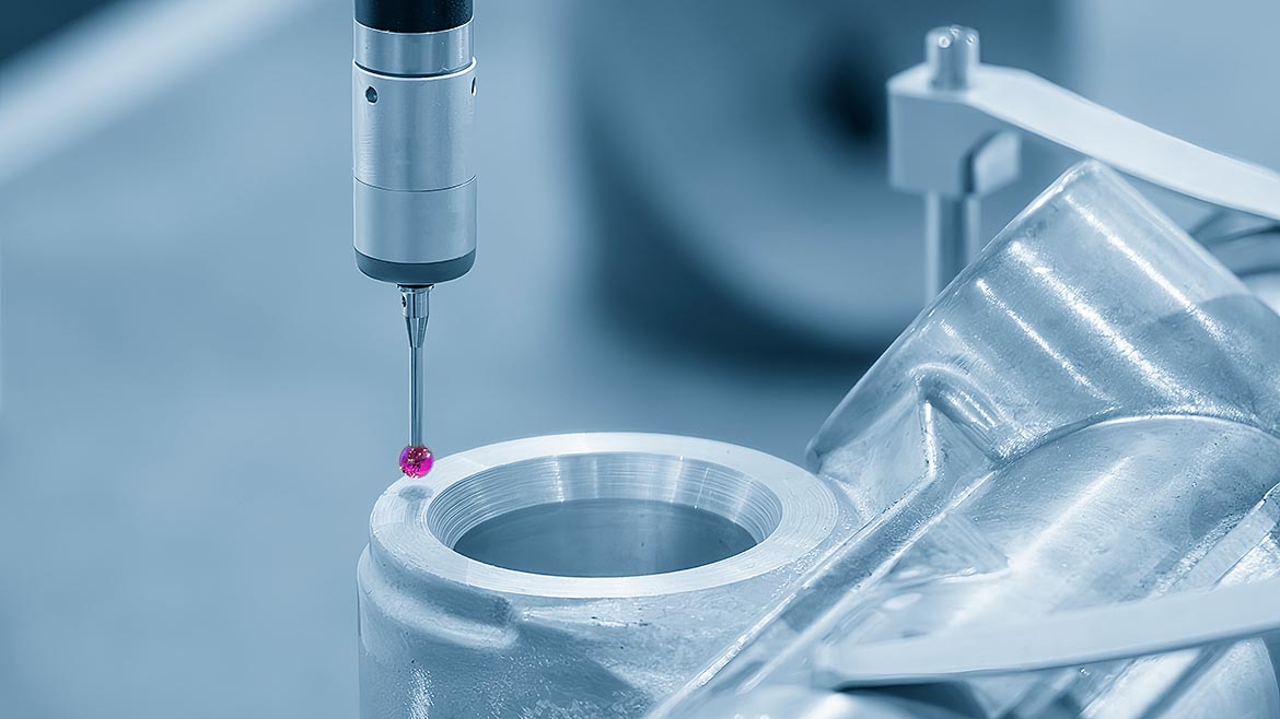 The CMM probe measuring the aluminum automotive parts.