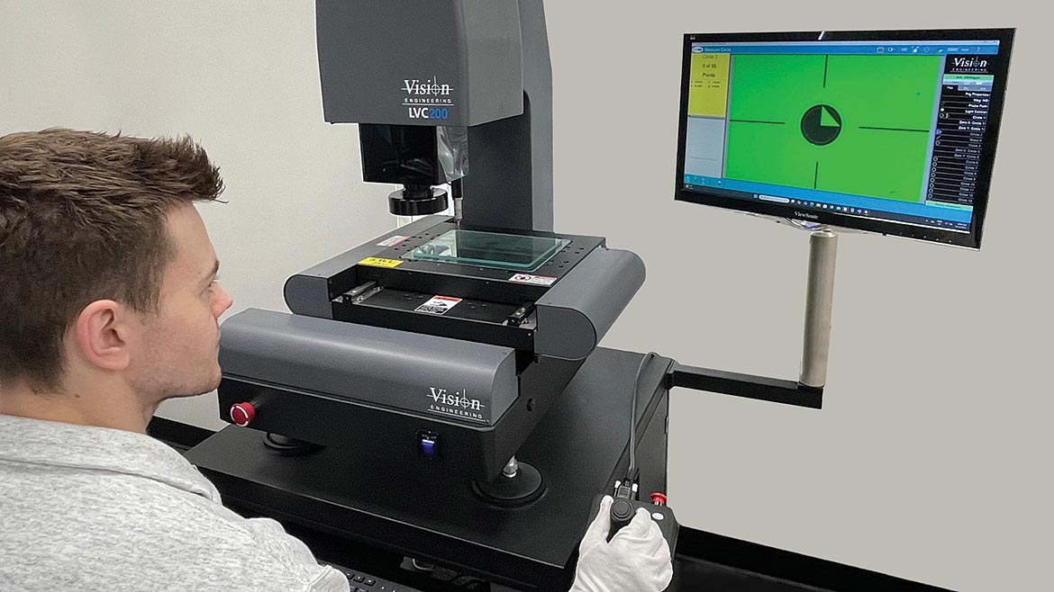 Technician working with the Vision Engineering LVC200.